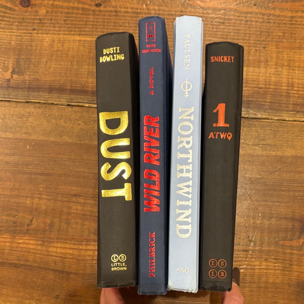 Set of Four Hardcover Books with Distinct Covers